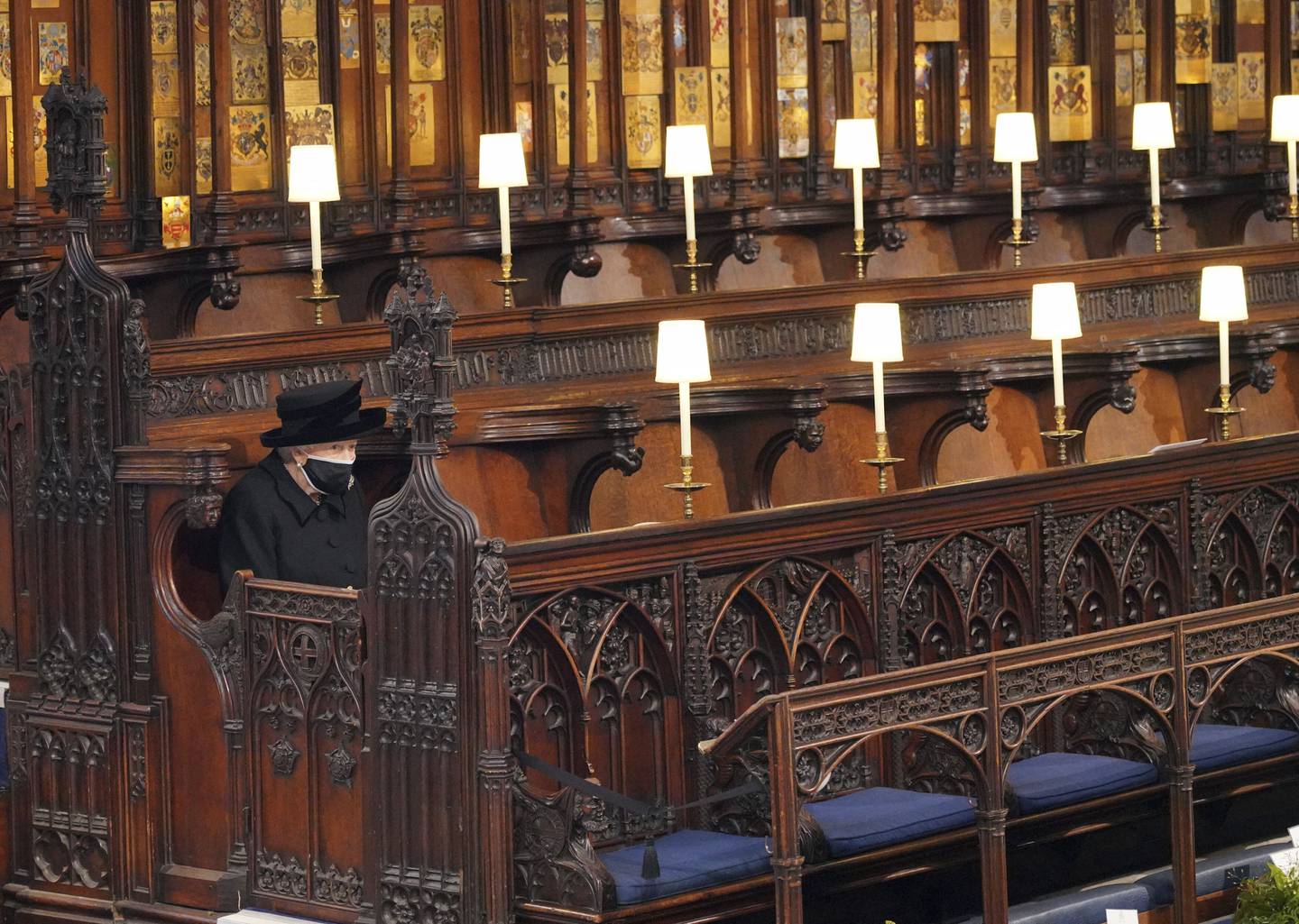 Queen Elizabeth sits alone in St George's Chapel at the funeral of Prince Philip. AP