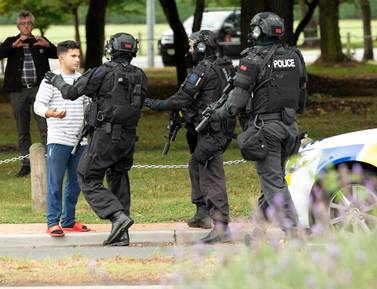 Armed Offenders Squad push back members of the public following the Christchurch shooting at the Masjid Al Noor on Deans Avenue, New Zealand, March 15, 2019. EPA