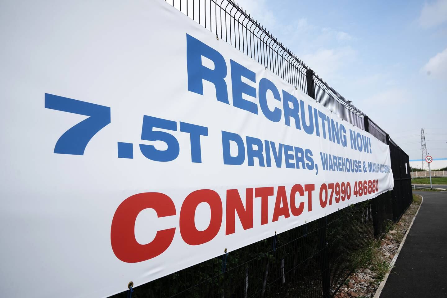  A banner advertises driving vacancies outside a distribution site in Warrington, England. Getty Images
