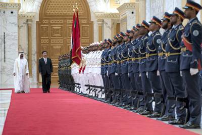 ABU DHABI, UNITED ARAB EMIRATES - July 20, 2018: HH Sheikh Mohamed bin Zayed Al Nahyan Crown Prince of Abu Dhabi Deputy Supreme Commander of the UAE Armed Forces (L) and HE Xi Jinping, President of China (R), inspect the UAE Armed Forces honor guard during a reception at the Presidential Palace. 

( Mohamed Al Hammadi / Crown Prince Court - Abu Dhabi )
---