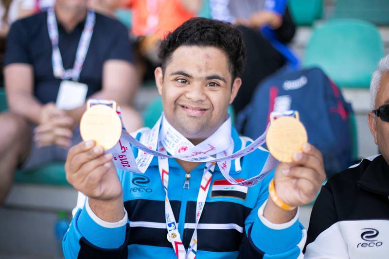 DUBAI, UNITED ARAB EMIRATES - March 19 2019.
Rami Al Azraee from Iraq holds his medals at the Special Olympics World Games athletics competition in Dubai Police Academy Stadium.

 (Photo by Reem Mohammed/The National)

Reporter: 
Section:  NA