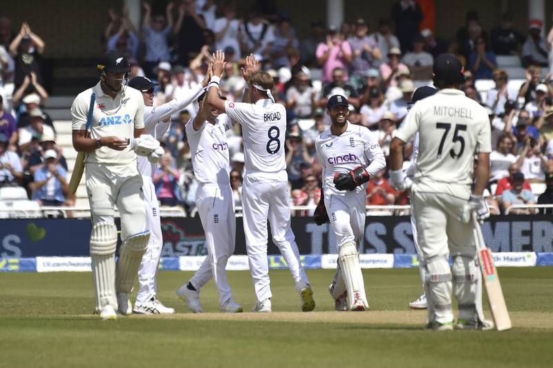 England bowler Stuart Broad celebrates with teammates the dismissal of New Zealand's Kyle Jamieson for one. AP