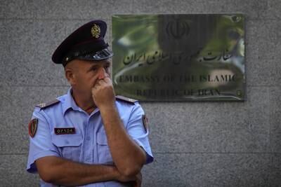 An Albanian police officer stands in front of the Iranian embassy. Reuters