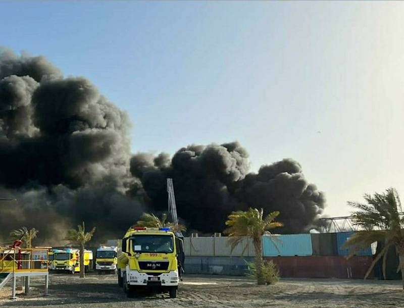 Firefighters try to douse a fire that started in Mussaffah Industrial Area on Wednesday evening. Photo: Abu Dhabi Police
