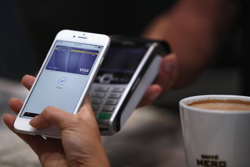 DUBAI, UNITED ARAB EMIRATES - OCTOBER 22:  A customer makes a transaction using Apple Pay in the UAE at The Dubai Mall on October 22, 2017 in Dubai, United Arab Emirates.  (Photo by Francois Nel/Getty Images)