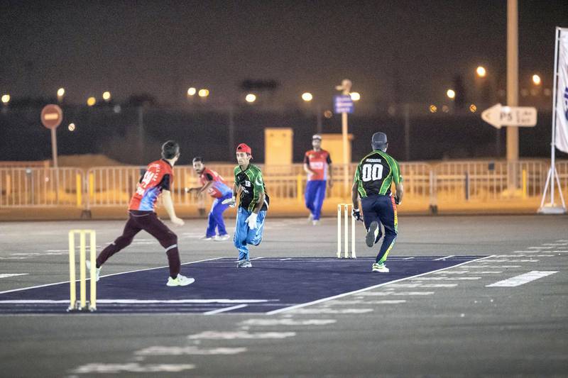 DUBAI, UNITED ARAB EMIRATES. 30 MAY 2019. Ramadan street cricket tournament held in the [parking lot of Global Village. (Photo: Antonie Robertson/The National) Journalist: Nick Webster Section: National.