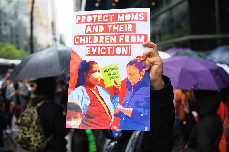 People gather for a rent relief rally at Governor Kathy Hochul's New York City office on May 6. Community activists were joined by mothers and grandmothers while holding flowers ahead of Mother's Day in the US this weekend. Getty Images / AFP
