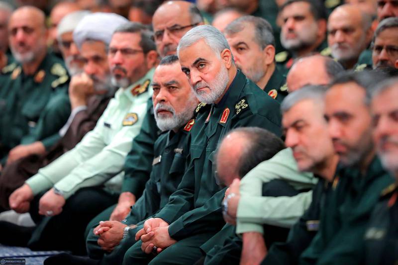 In this Wednesday, Oct. 2, 2019 photo, released by an official website of the office of the Iranian supreme leader, the head of the Revolutionary Guard's foreign wing, or Quds Force, Gen. Qassim Soleimani, center, attends a meeting of a group of the Guard members with Supreme Leader Ayatollah Ali Khamenei, in Tehran, Iran. The semi-official Fars news agency said Thursday, Oct. 3, 2019, that authorities foiled an assassination attempt against Soleimani last month. The report Thursday said the attempt against Soleimani occurred in September when Soleimani planned to attend a religious ceremony in the southeastern Kerman province. (Office of the Iranian Supreme Leader via AP)