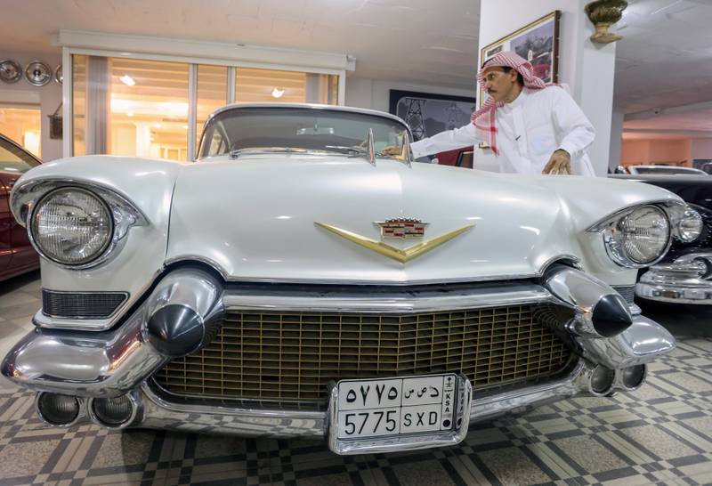 The vintage Cadillac gets some attention from Nasser Al Masari. His museum also functions as a repair shop for classic cars.