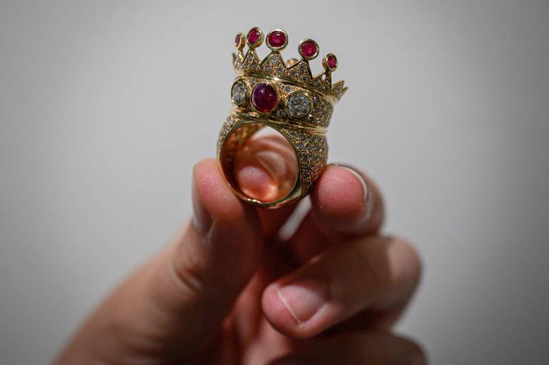 A gold, ruby and diamond crown ring, designed and worn by the late US rapper Tupac Shakur during his last public appearance in 1996. AFP