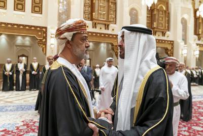 MUSCAT, OMAN - January 12, 2020: HH Sheikh Mohamed bin Zayed Al Nahyan, Crown Prince of Abu Dhabi and Deputy Supreme Commander of the UAE Armed Forces (R), offers condolences to HM Sayyid Haitham Bin Tariq Al Said, Sultan of Oman (L), on the passing of HM Qaboos bin Saeed, Sultan of Oman, at Al Alam Palace.

( Mohamed Al Hammadi / Ministry of Presidential Affairs )
---​