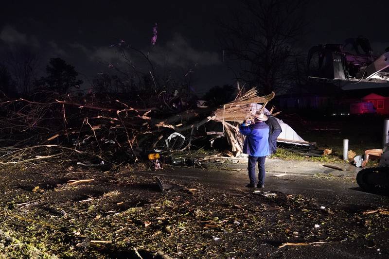 Photographing the damage. AP Photo