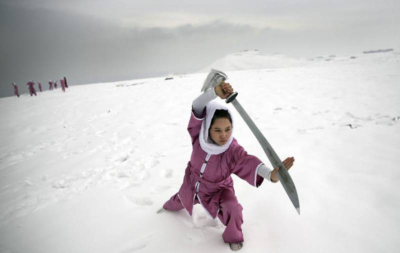 One of the students practises with a Shaolin sword on a hilltop in the Afghan capital on January 25, 2017. Massoud Hossaini / AP Photos