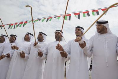 Men dance during National Day celebrations at the Crown Prince Court of Abu Dhabi. Mohamed Al Hammadi / Crown Prince Court - Abu Dhabi
