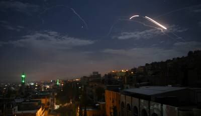 TOPSHOT - A picture taken early on January 21, 2019 shows Syrian air defence batteries responding to what the Syrian state media said were Israeli missiles targeting Damascus. Israel struck what it said were Iranian targets in Syria today in response to rocket fire it blamed on Iran, sparking concerns of an escalation after a monitor reported 11 fighters killed. Israel openly claimed responsibility for the strikes against facilities it said belonged to the Iranian Revolutionary Guards' Quds Force, continuing its recent practice of speaking more openly about such raids.
 / AFP / STR
