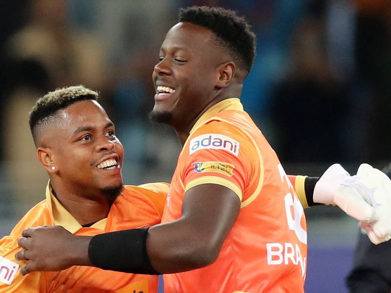 Gulf Giants' Carlos Brathwaite and Shimron Hetmyer (L) celebrate victory against the Desert Vipers in the final of the International League T20 at the Dubai International Stadium on February 12, 2023. 