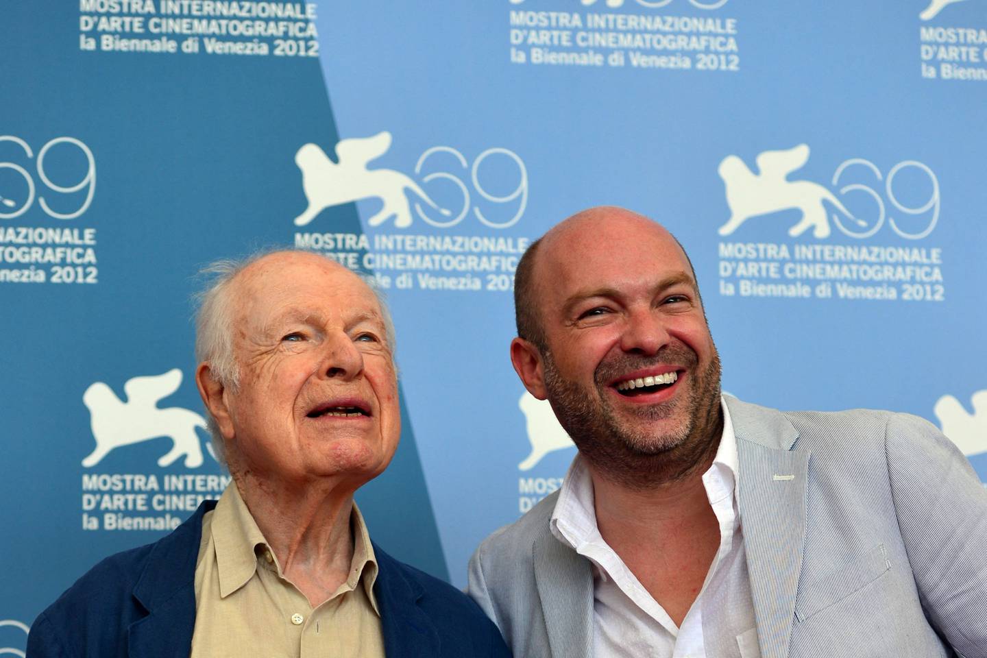 Peter Brook, left, and his son director Simon Brook pose during the 69th Venice Film Festival. AFP