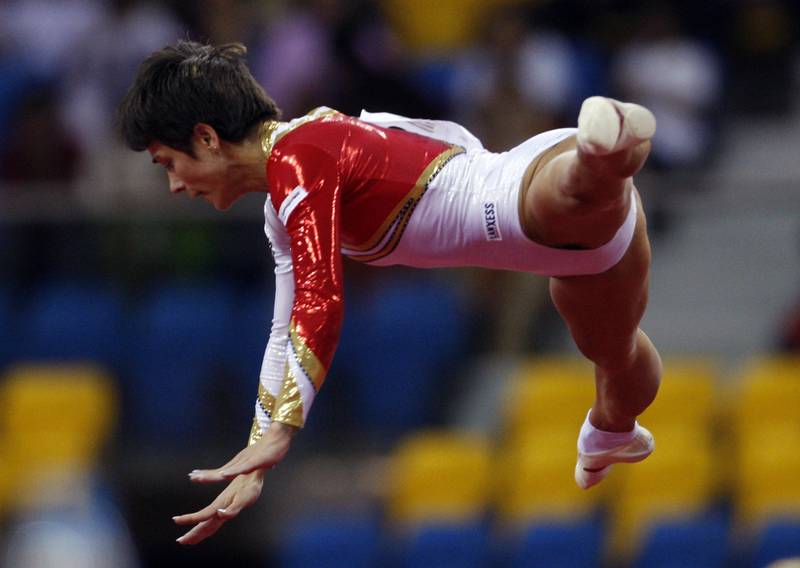 Oksana Chusovitina of Germany performs on the floor during the women's individual final at the Doha Gymnastics World Cup at the Aspire Academy March 6, 2008.