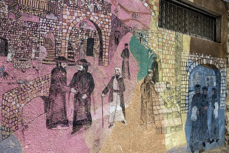 Biblical paintings are seen on the outside of buildings of the Beit Romano Jewish settlement in Hebron where the Israeli government recently announced it will build 31 new housing units .
(Photo by Heidi Levine for The National).