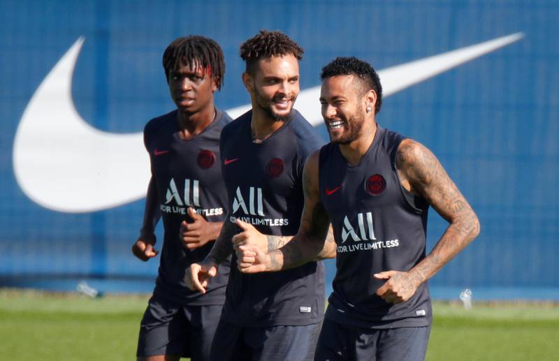 Neymar with Layvin Kurzawa and teammates during training. Reuters