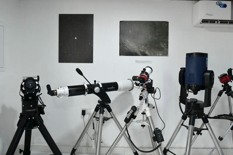 Various mounts and different types of telescopes in the lecture hall 

