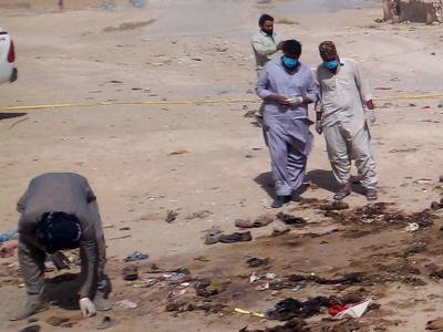 Security officials examine the site of the suicide bomb attack in Mastung, Balochistan, south-western Pakistan. AFP
