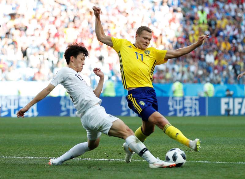 Sweden's Viktor Claesson in action with South Korea's Lee Jae-sung. Matthew Childs / Reuters