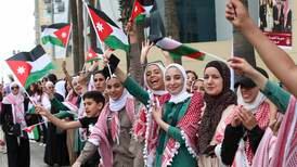 Joyous Jordanians gather to greet Prince Hussein wedding convoy