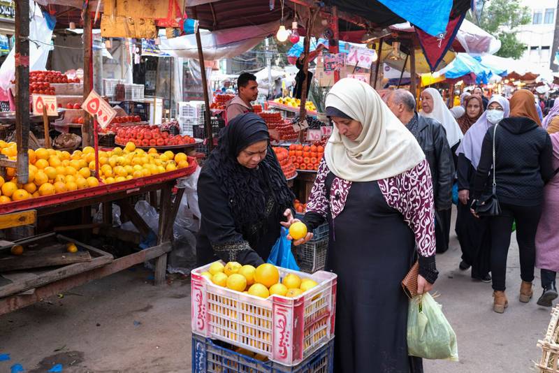 Shoppers at fruit market in Alexandria, Egypt, where inflation is nearing 20 per cent. Bloomberg