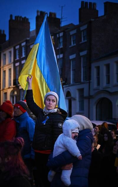 Annabel Lee-Ellis's picture of a member of the public holding a flag in support of Ukraine, at St Luke's church in Liverpool, has been shortlisted in the Nikon Student Photographer of the Year category