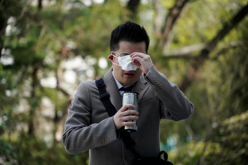 Park Hyun, a professor of Pusan National University Park Hyun who used to be a coronavirus patient, drinks a warm water upon his arrival to Pusan National University in Busan, South Korea, March 30, 2020. REUTERS/Kim Hong-Ji