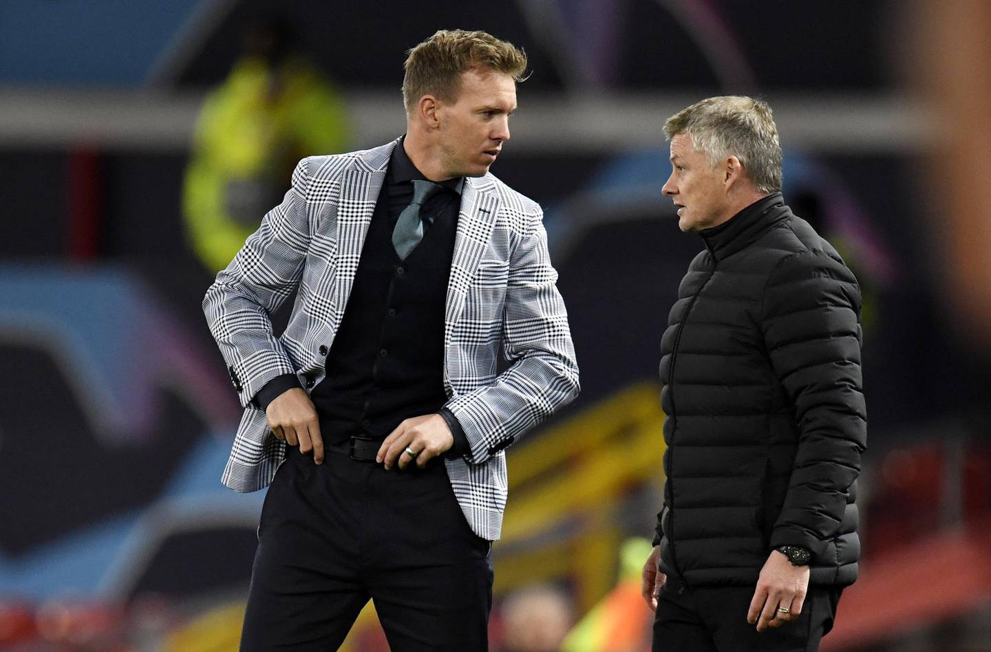 epa08782057 Manchester United manager Ole Gunnar Solskjaer (R) speaks with his RB Leipzig counterpart Julian Nagelsmann at the end of the UEFA Champions League group H match Manchester United vs RB Leipzig in Manchester, Britain 28 October 2020.  EPA/Peter Powell