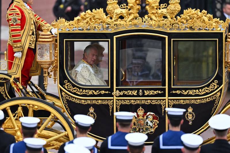 King Charles III in the Diamond Jubilee Coach built in 2012 to commemorate the 60th anniversary of the reign of Queen Elizabeth II, in London. Getty Images