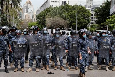 Lebanese policemen guard the site where anti-government protesters clash with security forces during a protest against Judge Ghada Aoun, the chief prosecutor for the region of Mount Lebanon, on the road leading to the Palace of Justice in Beirut, Lebanon. EPA