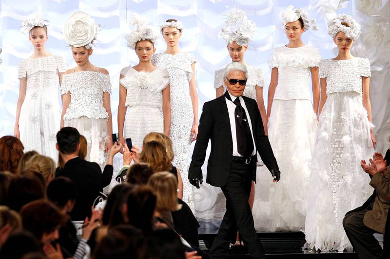 FILE PHOTO: German designer Karl Lagerfeld appears at the end of his Spring-Summer Haute Couture 2009 fashion show for French fashion house Chanel in Paris, France January 27, 2009.  REUTERS/Jacky Naegelen/File Photo