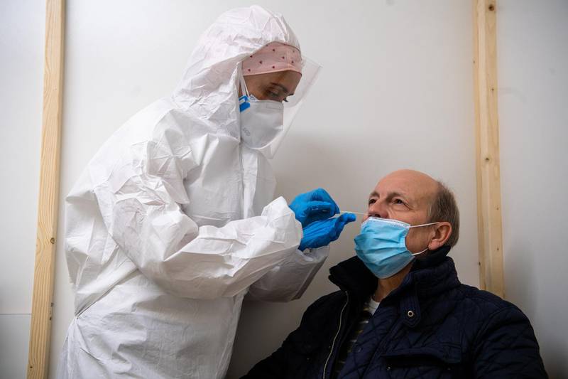 CHARLEROI, BELGIUM - NOVEMBER 05: A man is tested for covid-19 in the basement of the University Hospital of Charleroi on November 5, 2020 in Charleroi, Belgium. On October 28, the Charleroi University Hospital opened a space for critical Covid-19 patients as well as an underground drive-in testing centre. The facility was set up in four days by ISPPC technical teams, in the staff parking lot of the Marie Curie Hospital. For the first time in two months, the number of people hospitalized for Coronavirus in Belgium has dropped slightly, from 7,487 to 7,405. (Photo by Jean-Christophe Guillaume/Getty Images)