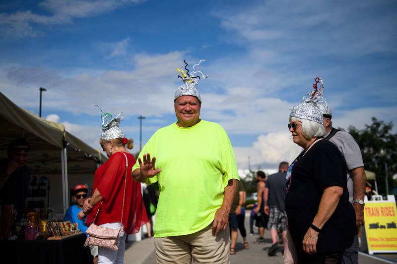 People wear tin foil hats during the UFO Festival. AFP