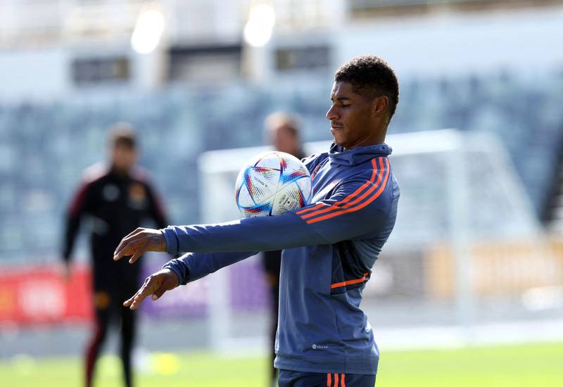 Manchester United's Marcus Rashford balances the ball on his arms during a training session in Perth. AFP