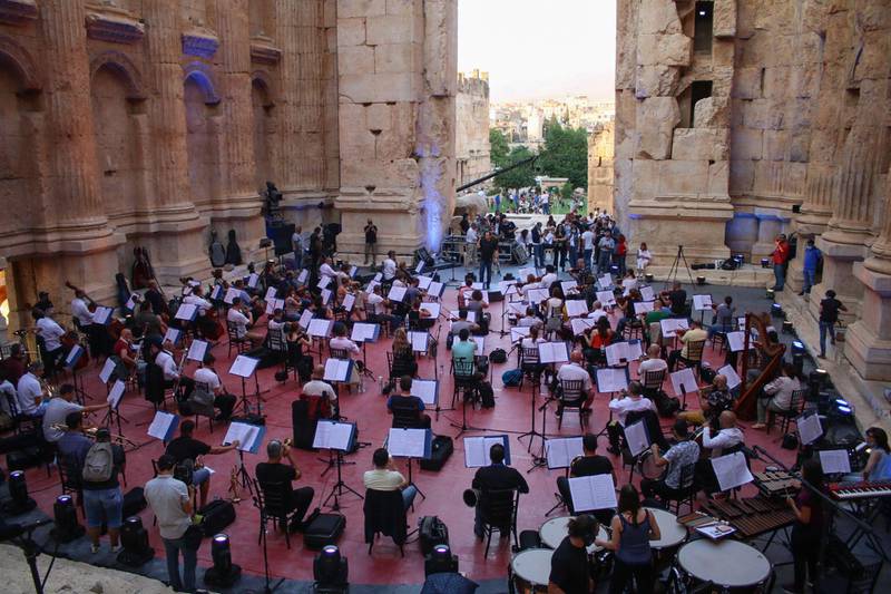 Maestro Harout Fazlian conducts rehearsals ahead of the Sound of Resilience concert inside the Temple of Bacchus at the historic site of Baalbek in Lebanon's eastern Bekaa Valley. AFP