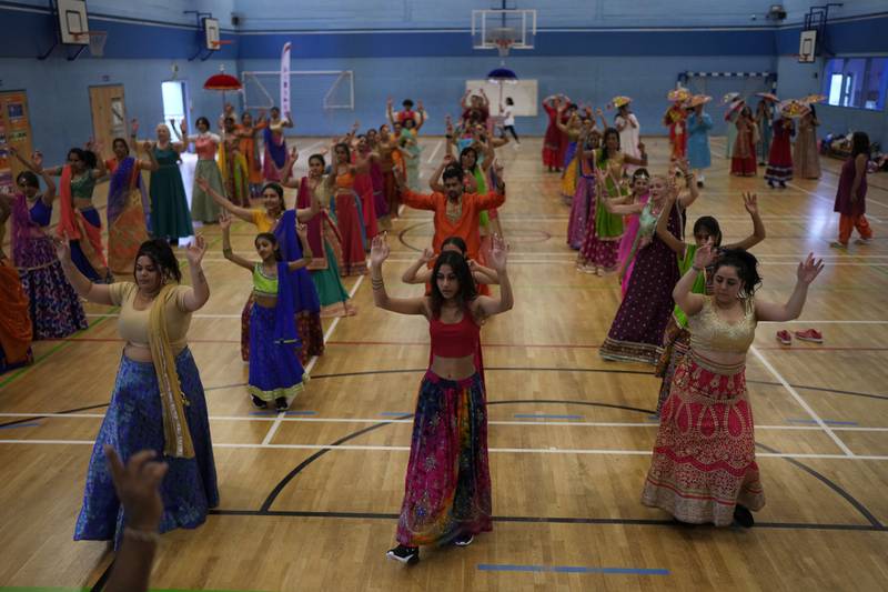 Nutkhut creative company rehearses for its Bollywood-style performance ‘The Wedding Party’ at Northolt High School, north-west London, which will be part of the procession at the platinum jubilee pageant. All photos: AP