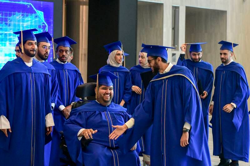 The first graduates at the Mohamed bin Zayed University of Artificial Intelligence celebrate their achievement. All photos by Khushnum Bhandari / The National 