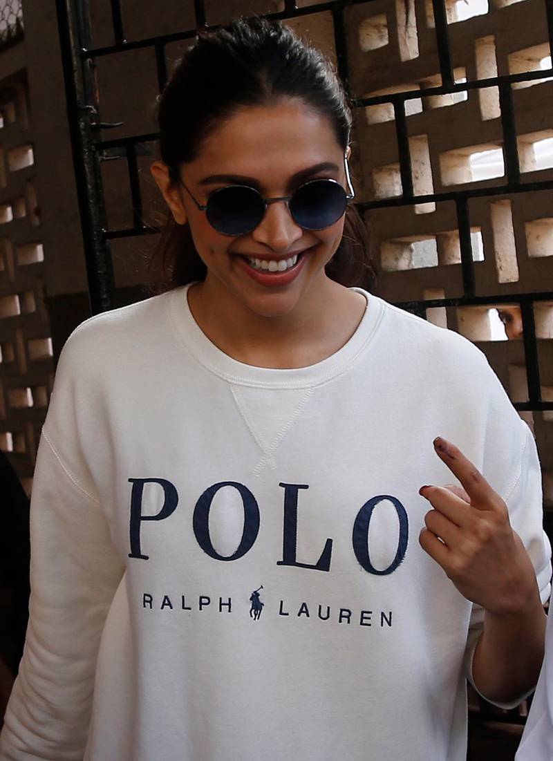 Bollywood actress Deepika Padukone shows indelible ink mark on her index finger after casting her vote outside a polling station in Mumbai, Monday, Oct. 21, 2019. AP
