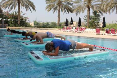 Doing core exercises while balancing on water is a great way to get fit while still having fun. Courtesy Float DXB