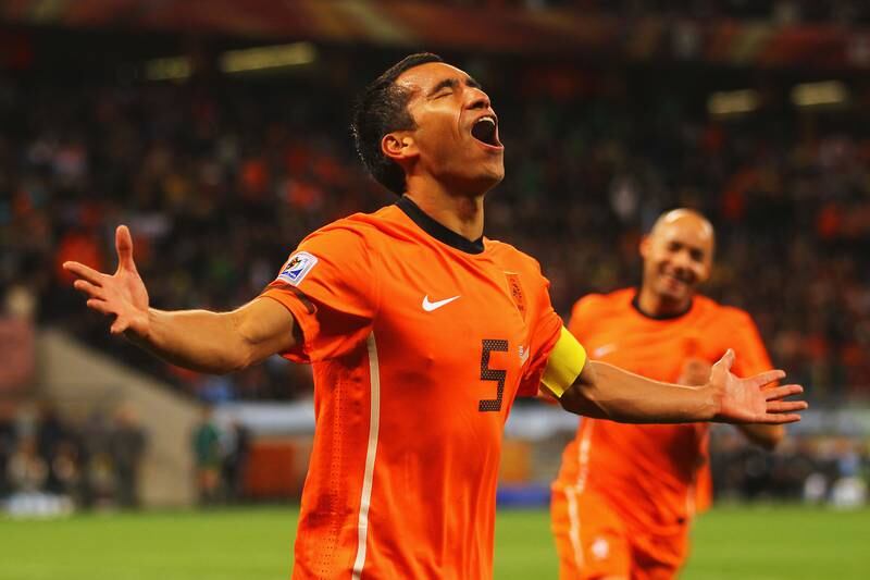 Netherlands captain Giovanni Van Bronckhorst celebrates scoring against Uruguay at the 2010 World Cup in South Africa. Getty