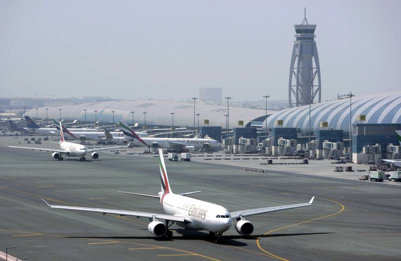 An Emirates airline passenger jet taxis on the tarmac at Dubai International airport. Passengers numbers continue to grow at the airport. AP