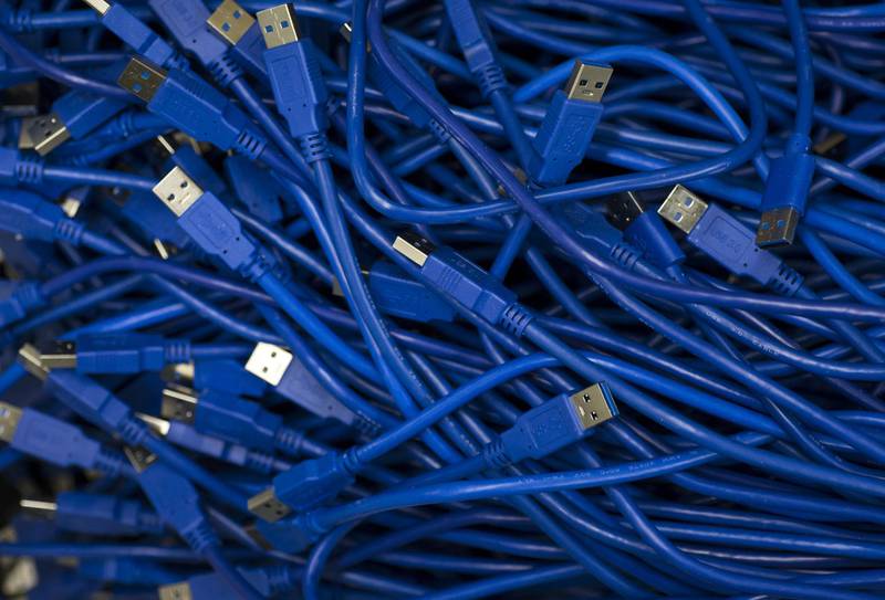 USB cables are seen inside the DMM Mining Farm, operated by DMM.com Co., in Kanazawa, Japan, on Tuesday, March 20, 2018. Japan is moving toward legalizing initial coin offerings, even as countries such as China and the U.S. restrict the fundraising technique because of their risks for investors. A government-backed study group laid out basic guidelines for further adoption of ICOs, according to a report published on April 5. Photographer: Tomohiro Ohsumi/Bloomberg