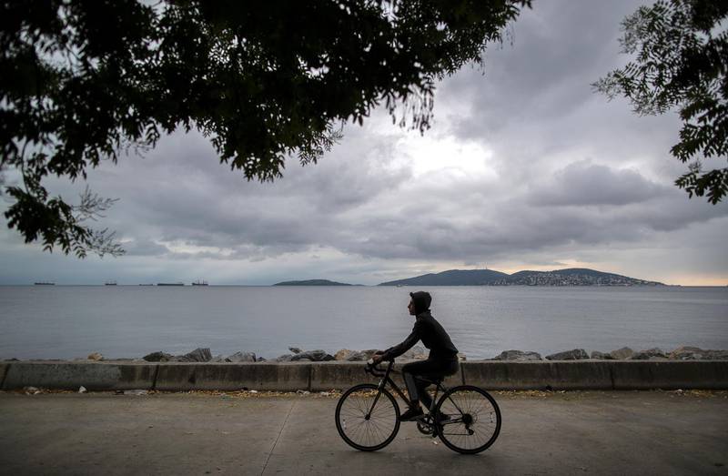 A man rides a bicycle near the Marmara sea in Istanbul, Turkey. Turkish authorities have now allowed the reopening of restaurants, cafes, parks and beaches, as well as lifting the ban on inter-city travel imposed to contain the coronavirus.  EPA
