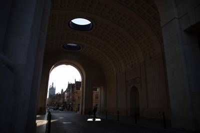A man stands in the sunlight under the First World War monument, Menin Gate, in Ypres, Belgium last Saturday. AP Photo