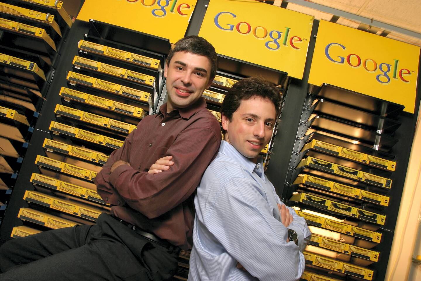 Larry Page (L), Co-Founder and President, Products and Sergey Brin, Co-Founder and President, Technology pose inside the server room at Google's campus headquarters in Mountain View. They founded the company in 1998. (Photo by Kim Kulish/Corbis via Getty Images)