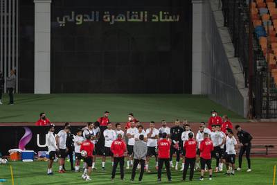 Egypt head coach Hossam El Badri speaks to his players during a training session for the in Cairo ahead of the Africa Cup of Nations qualification match against Kenya.